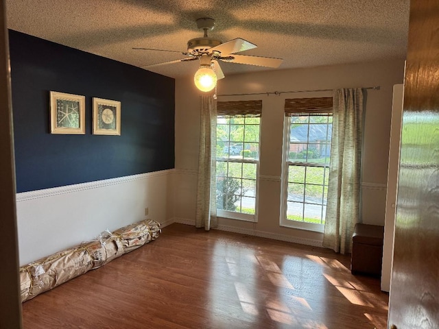 2761 Graniteridge Ct, Orange Park, FL 32065 - spare room featuring wood finished floors, a ceiling fan, a textured ceiling, and baseboards
