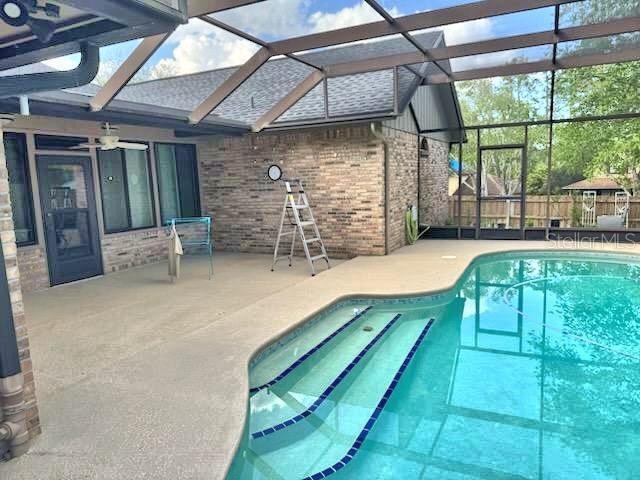 2761 Graniteridge Ct, Orange Park, FL 32065 - view of pool featuring a patio, a lanai, and fence