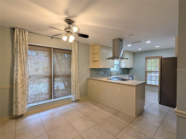 2761 Graniteridge Ct, Orange Park, FL 32065 - kitchen featuring island range hood, freestanding refrigerator, ceiling fan, light countertops, and a sink