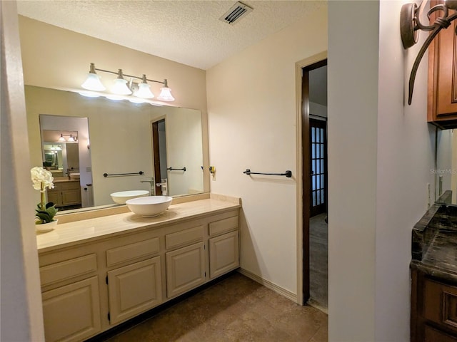 2761 Graniteridge Ct, Orange Park, FL 32065 - bathroom featuring a textured ceiling and vanity
