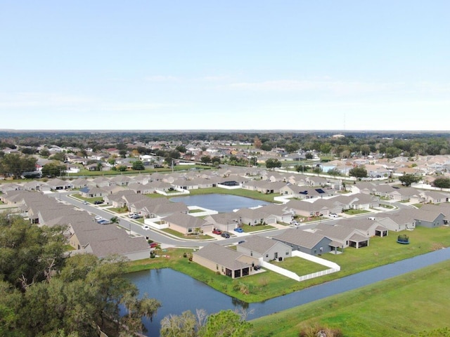 birds eye view of property featuring a water view and a residential view