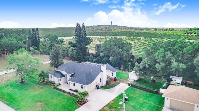 birds eye view of property featuring a rural view