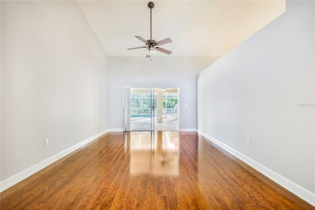 empty room with baseboards, a ceiling fan, and wood finished floors