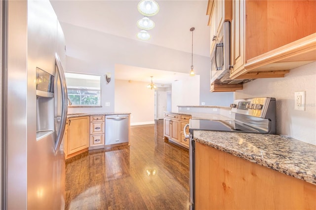 kitchen featuring decorative light fixtures, dark wood-type flooring, lofted ceiling, appliances with stainless steel finishes, and light brown cabinetry