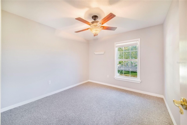 empty room featuring carpet floors, baseboards, and a ceiling fan