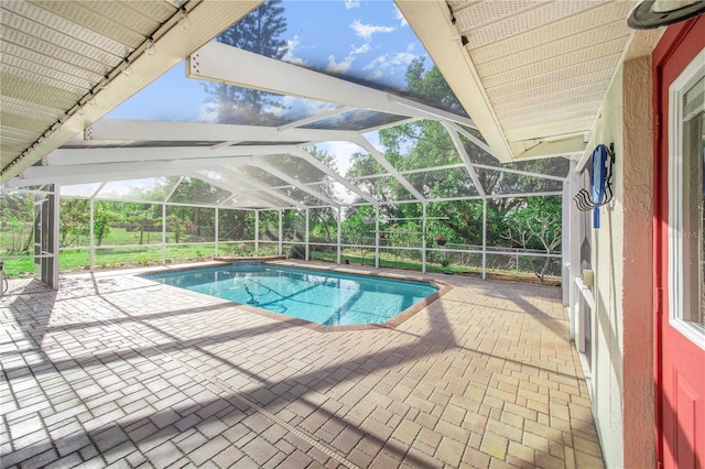 outdoor pool with a patio and a lanai