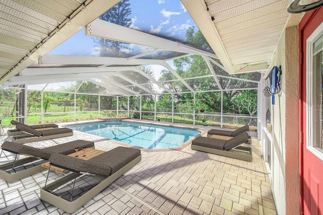 outdoor pool featuring a lanai and a patio area
