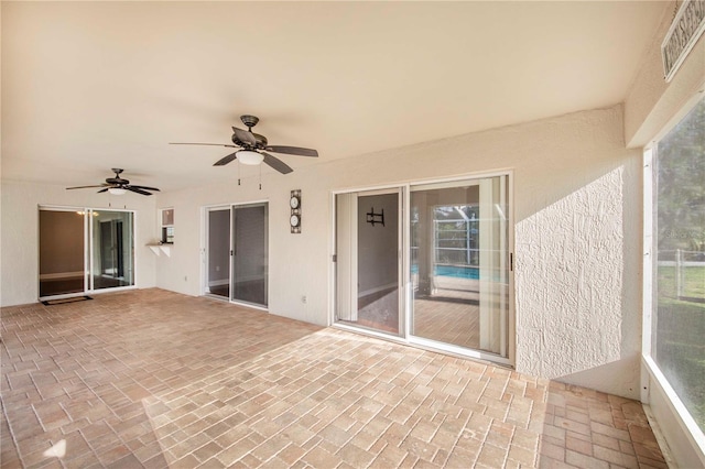 unfurnished sunroom with visible vents