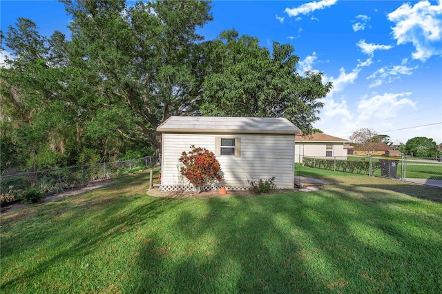 view of shed featuring a fenced backyard