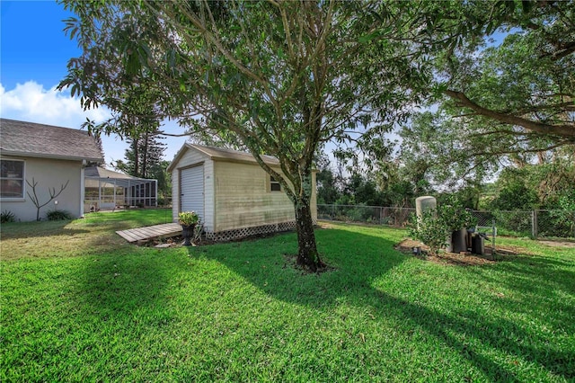 view of yard with a fenced backyard and an outdoor structure