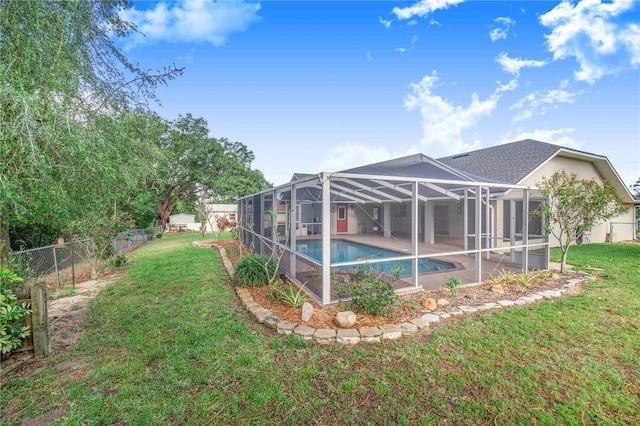 view of yard featuring a patio area, a fenced backyard, a fenced in pool, and a lanai
