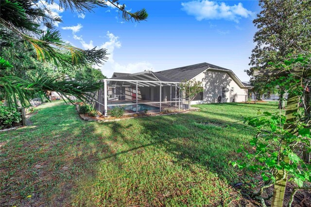 view of yard with a lanai