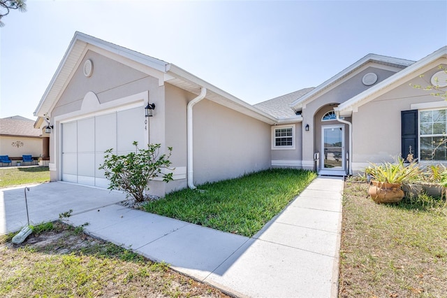 404 Rio Grande Ct, Poinciana, FL 34759 - single story home featuring a garage, driveway, and stucco siding