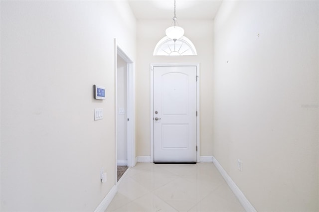 404 Rio Grande Ct, Poinciana, FL 34759 - doorway to outside featuring light tile patterned floors and baseboards