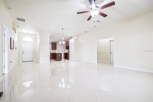 404 Rio Grande Ct, Poinciana, FL 34759 - empty room featuring light tile patterned floors, visible vents, baseboards, and ceiling fan