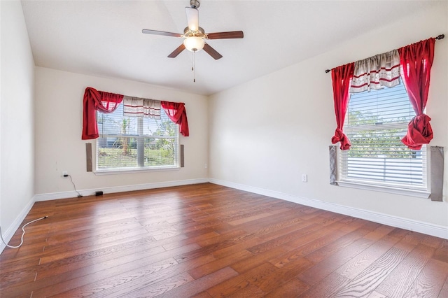 404 Rio Grande Ct, Poinciana, FL 34759 - empty room with wood-type flooring, ceiling fan, and baseboards
