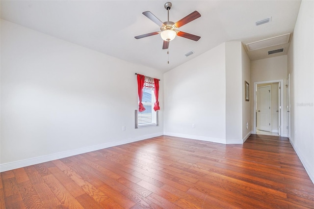 404 Rio Grande Ct, Poinciana, FL 34759 - empty room featuring visible vents, baseboards, and wood finished floors