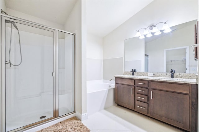 404 Rio Grande Ct, Poinciana, FL 34759 - bathroom with a stall shower, a garden tub, double vanity, and a sink