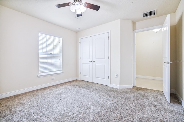 404 Rio Grande Ct, Poinciana, FL 34759 - unfurnished bedroom featuring carpet, visible vents, a closet, and baseboards
