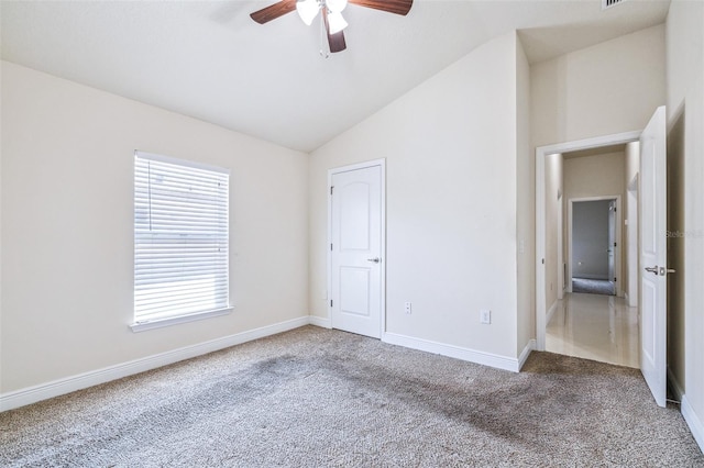 404 Rio Grande Ct, Poinciana, FL 34759 - unfurnished bedroom featuring carpet, baseboards, a ceiling fan, and lofted ceiling