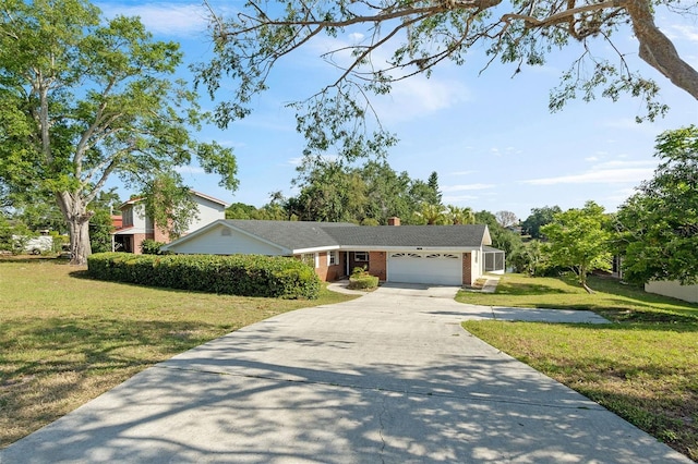 102 Lake Ring Dr, Winter Haven, FL 33884 - single story home featuring a garage, a front yard, brick siding, and driveway