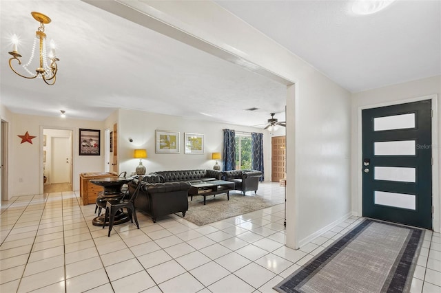 102 Lake Ring Dr, Winter Haven, FL 33884 - entrance foyer with ceiling fan with notable chandelier and light tile patterned floors