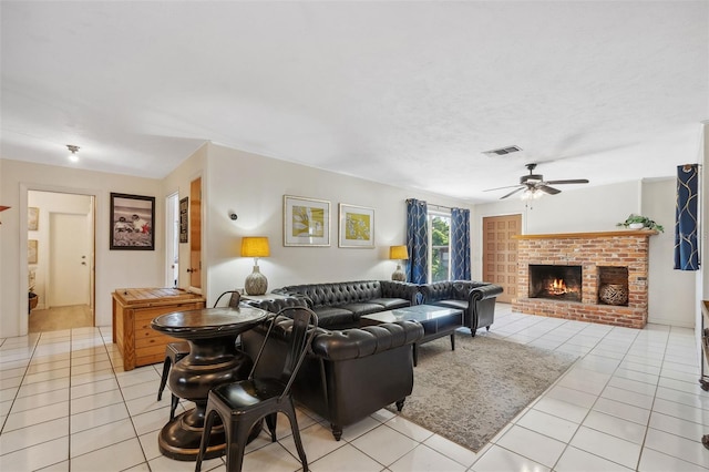 102 Lake Ring Dr, Winter Haven, FL 33884 - living area with visible vents, a ceiling fan, light tile patterned flooring, and a fireplace