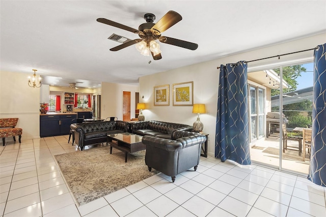 102 Lake Ring Dr, Winter Haven, FL 33884 - living area with ceiling fan with notable chandelier, light tile patterned floors, and visible vents