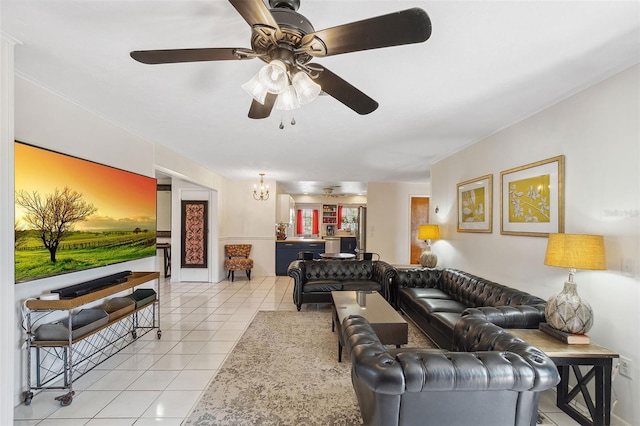 102 Lake Ring Dr, Winter Haven, FL 33884 - living room featuring light tile patterned floors and ceiling fan with notable chandelier