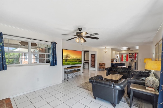 102 Lake Ring Dr, Winter Haven, FL 33884 - living room with visible vents, ceiling fan with notable chandelier, baseboards, and light tile patterned flooring