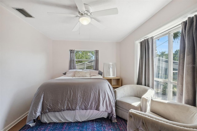 102 Lake Ring Dr, Winter Haven, FL 33884 - bedroom with baseboards, a ceiling fan, and visible vents