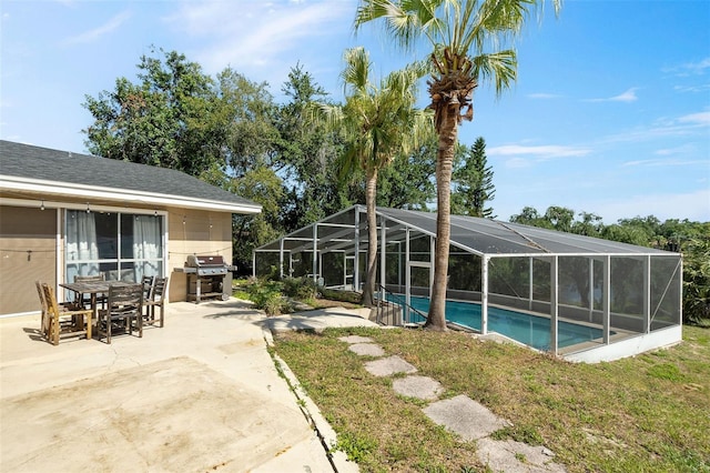 102 Lake Ring Dr, Winter Haven, FL 33884 - outdoor pool featuring a lanai, a patio, and grilling area