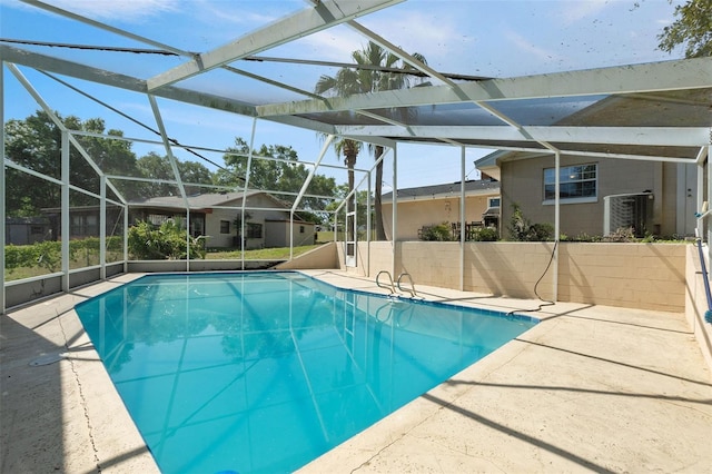 102 Lake Ring Dr, Winter Haven, FL 33884 - outdoor pool with a patio area and glass enclosure