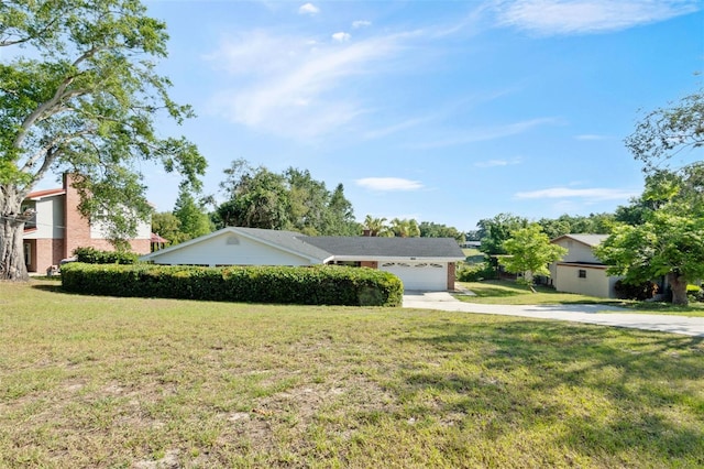 102 Lake Ring Dr, Winter Haven, FL 33884 - view of front of property with an attached garage, concrete driveway, and a front lawn