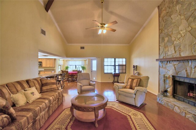 2611 State Road 557, Lake Alfred, FL 33850 - living area with a fireplace, a ceiling fan, visible vents, high vaulted ceiling, and wood finished floors