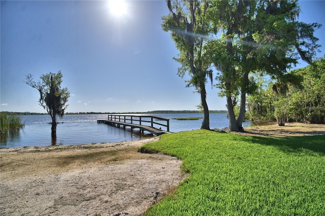 2611 State Road 557, Lake Alfred, FL 33850 - dock area with a water view and a lawn