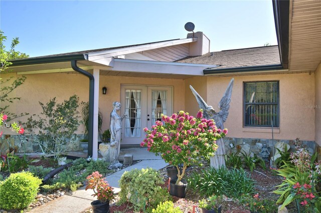2611 State Road 557, Lake Alfred, FL 33850 - property entrance with french doors and stucco siding