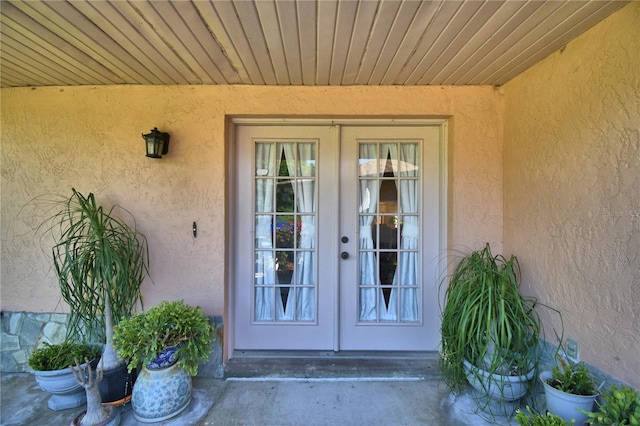 2611 State Road 557, Lake Alfred, FL 33850 - property entrance featuring french doors and stucco siding