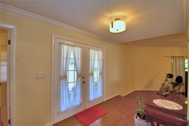 2611 State Road 557, Lake Alfred, FL 33850 - entryway featuring baseboards, french doors, a textured ceiling, and ornamental molding