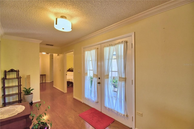 2611 State Road 557, Lake Alfred, FL 33850 - doorway to outside featuring ornamental molding, french doors, a textured ceiling, visible vents, and wood finished floors