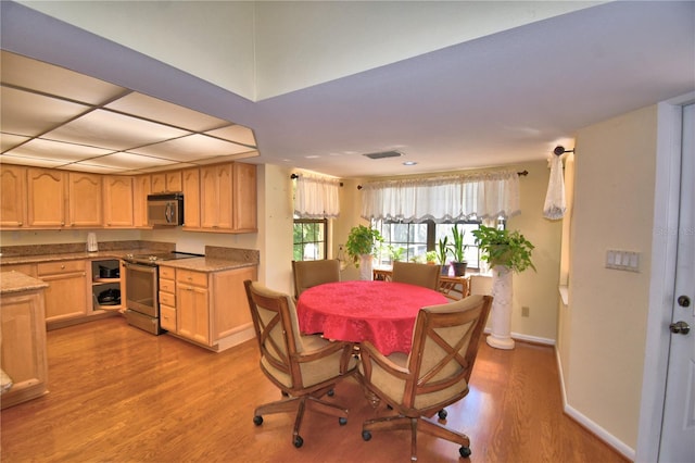 2611 State Road 557, Lake Alfred, FL 33850 - dining room with visible vents, baseboards, and light wood finished floors