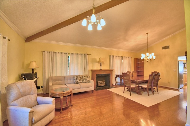 2611 State Road 557, Lake Alfred, FL 33850 - dining area featuring lofted ceiling with beams, visible vents, a chandelier, wood finished floors, and baseboards