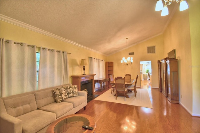 2611 State Road 557, Lake Alfred, FL 33850 - living area featuring wood finished floors, baseboards, ornamental molding, and visible vents