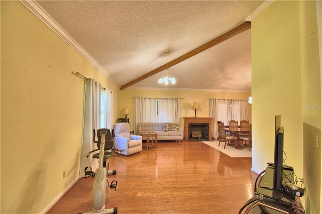 2611 State Road 557, Lake Alfred, FL 33850 - living area featuring crown molding, a textured ceiling, a chandelier, wood finished floors, and lofted ceiling