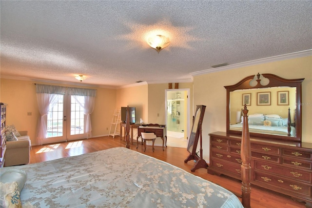 2611 State Road 557, Lake Alfred, FL 33850 - bedroom with french doors, a textured ceiling, crown molding, access to exterior, and wood finished floors