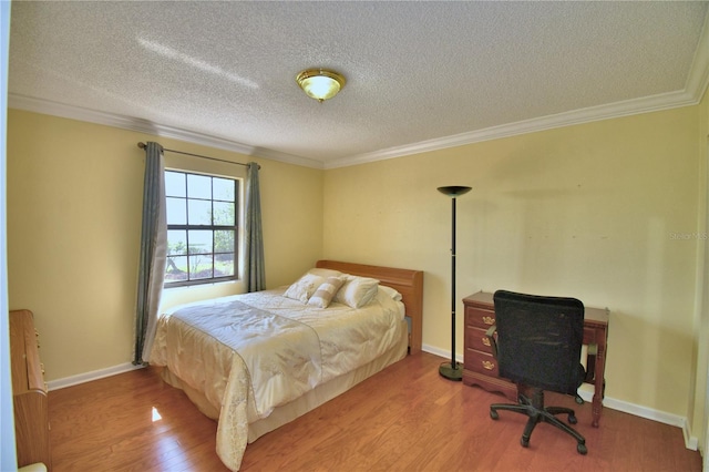 2611 State Road 557, Lake Alfred, FL 33850 - bedroom featuring ornamental molding, baseboards, wood finished floors, and a textured ceiling