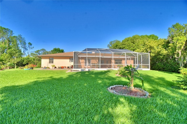 2611 State Road 557, Lake Alfred, FL 33850 - exterior space featuring a lanai, a yard, and stucco siding