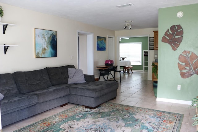24391 NW 172nd Ave, High Springs, FL 32643 - living room featuring visible vents, baseboards, and light tile patterned flooring