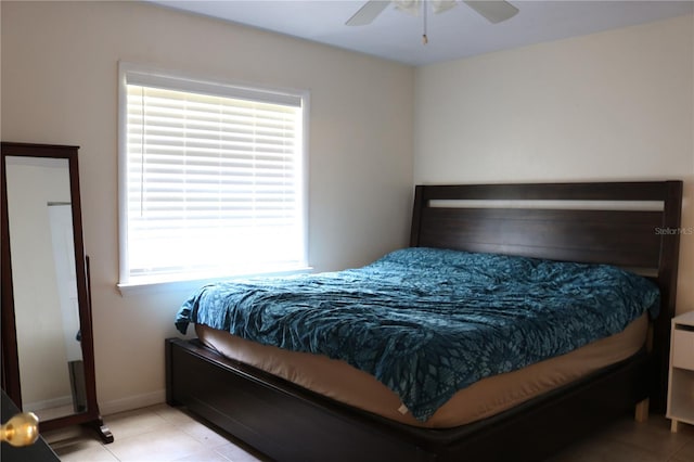 24391 NW 172nd Ave, High Springs, FL 32643 - bedroom with light tile patterned floors, baseboards, and a ceiling fan