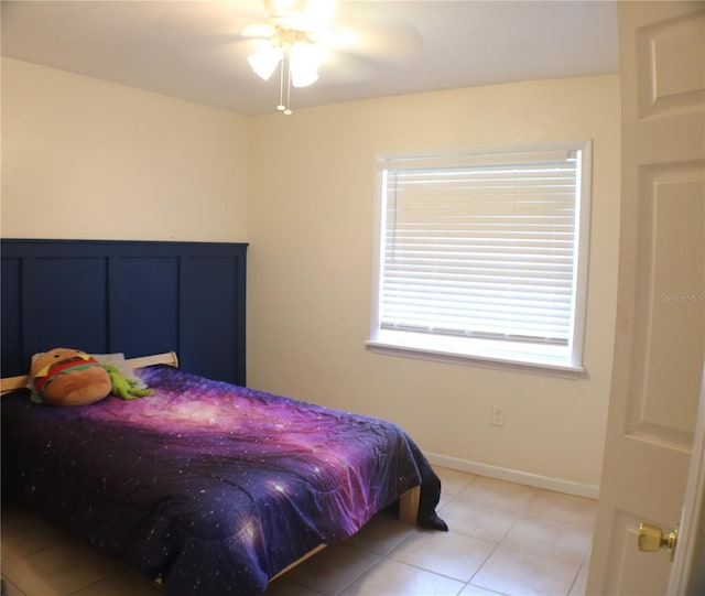 24391 NW 172nd Ave, High Springs, FL 32643 - bedroom featuring baseboards, a ceiling fan, and light tile patterned flooring
